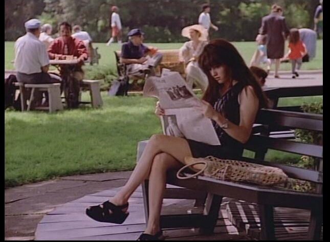 Brenda reading in a park in Paris