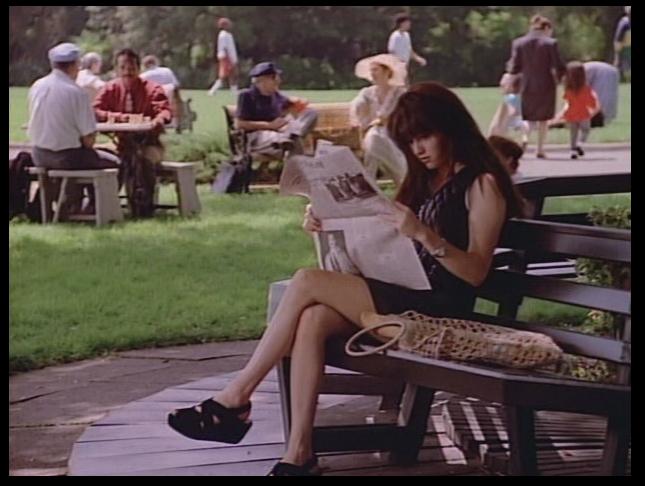Brenda reading in a park in Paris