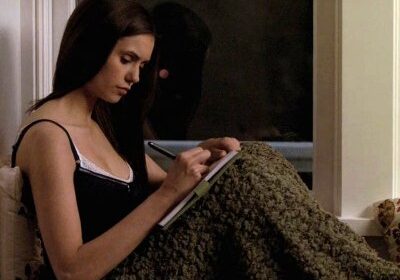 Elena writing in a diary