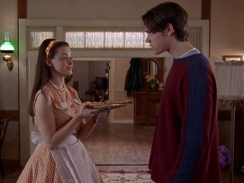 Rory serving Dean an appetizer